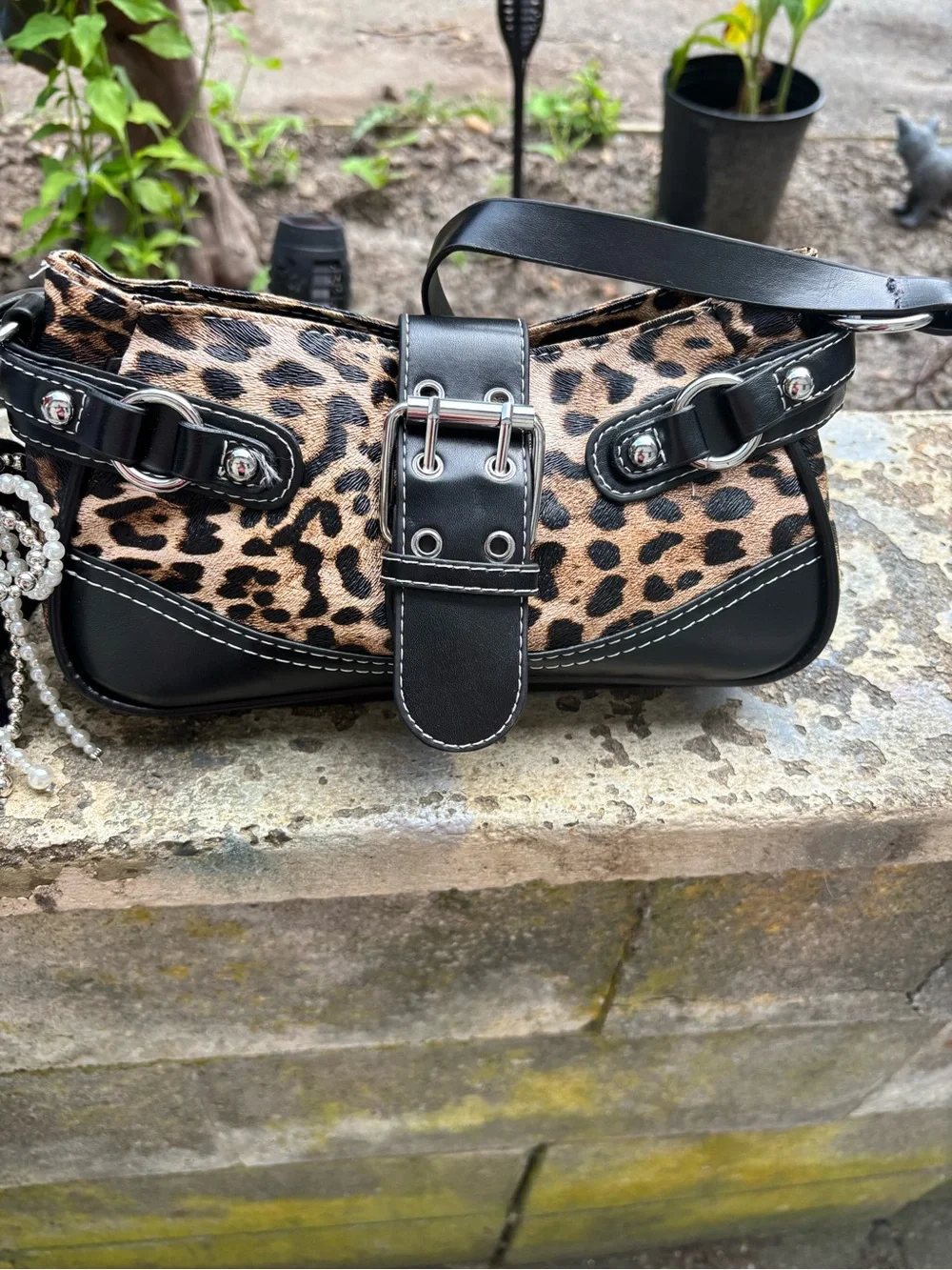 Leopard Print Shoulder Bag with Black Trim and Buckle Accent